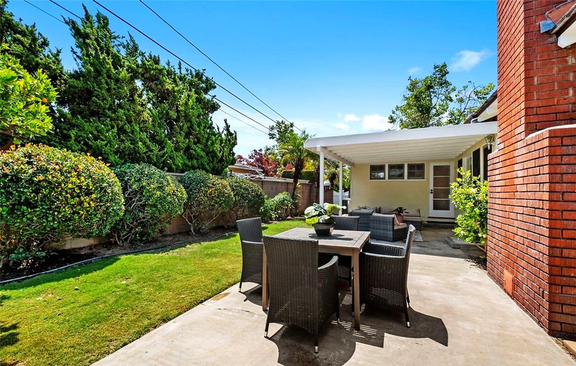 Outdoor dining set on the backyard patio, Santa Ana