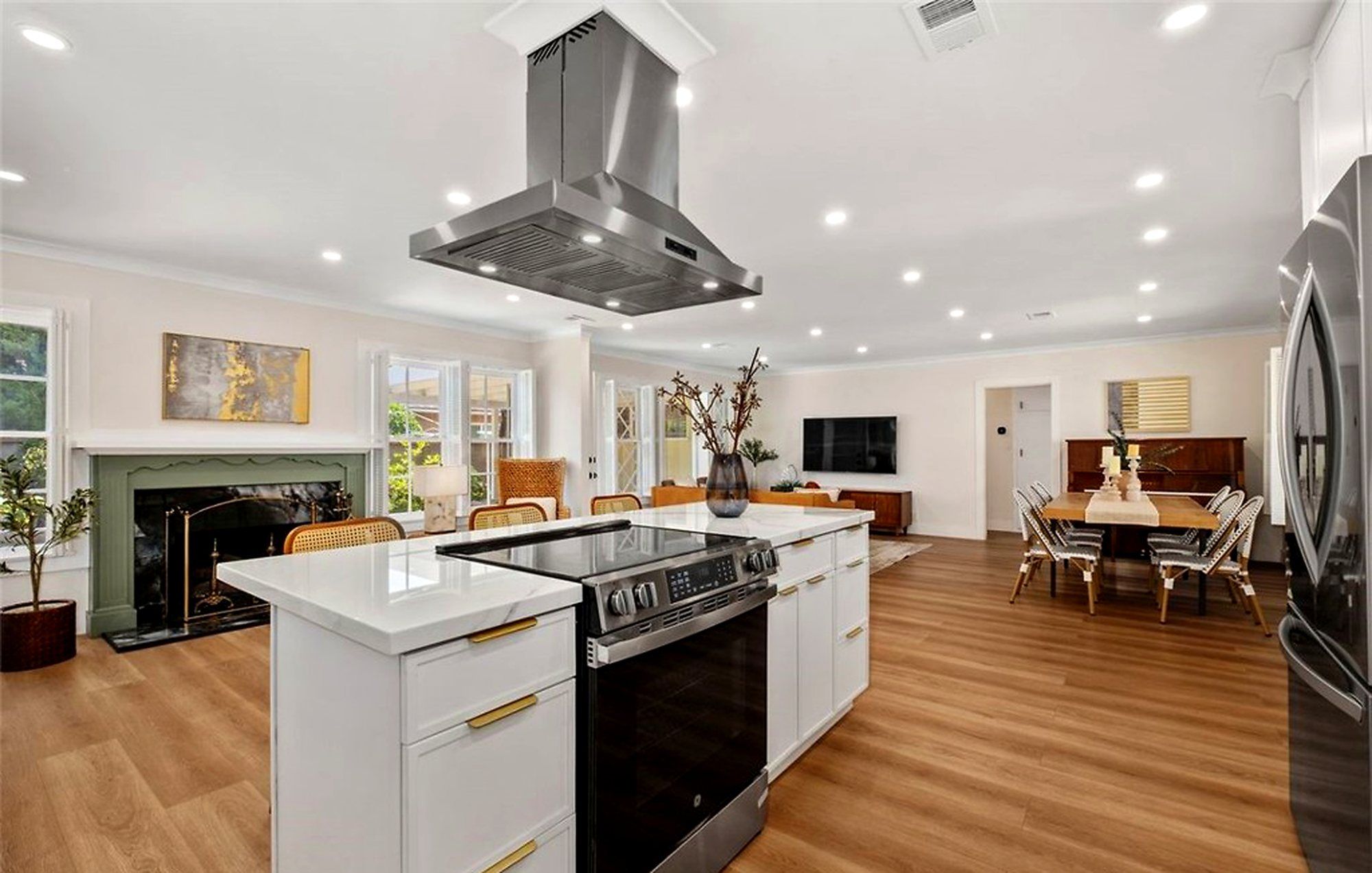 Island cooktop under a stainless hood, looking toward the living room, Santa Ana