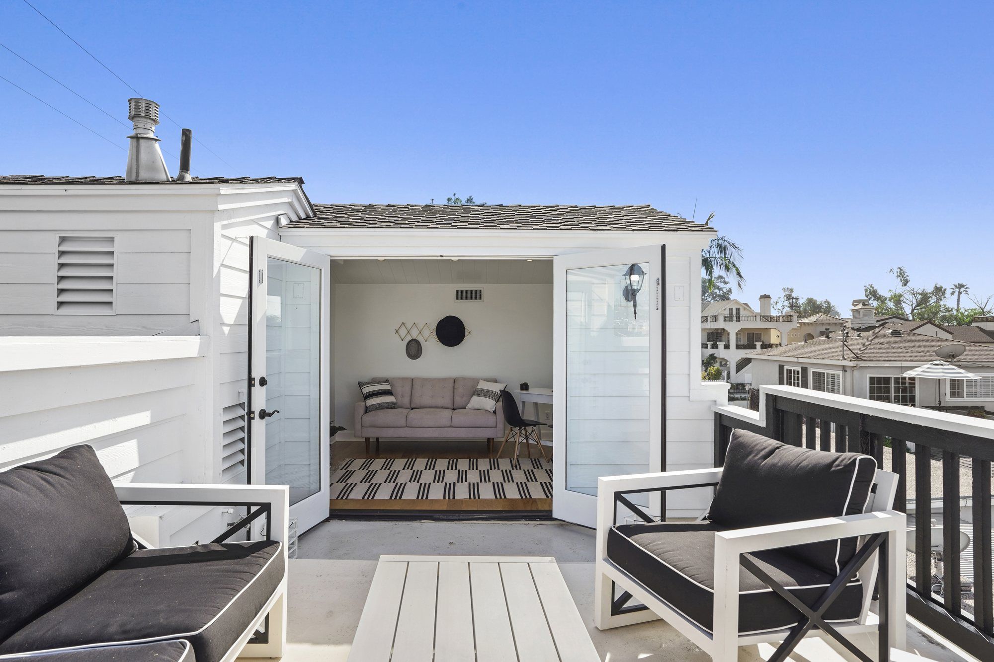 Roof deck seating, looking into the top-floor room, Newport Beach