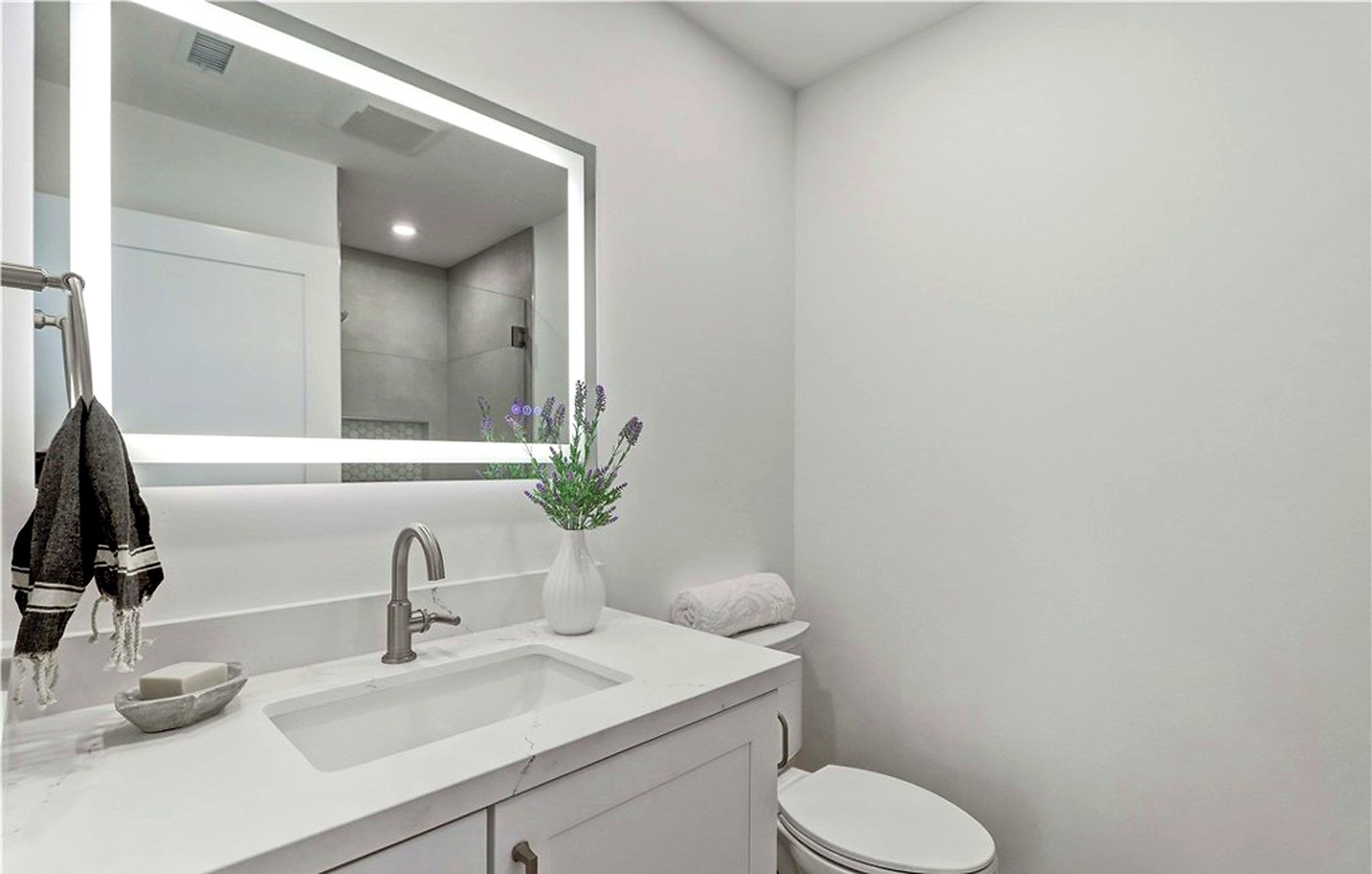 Bathroom vanity with a lighted mirror, Laguna Woods