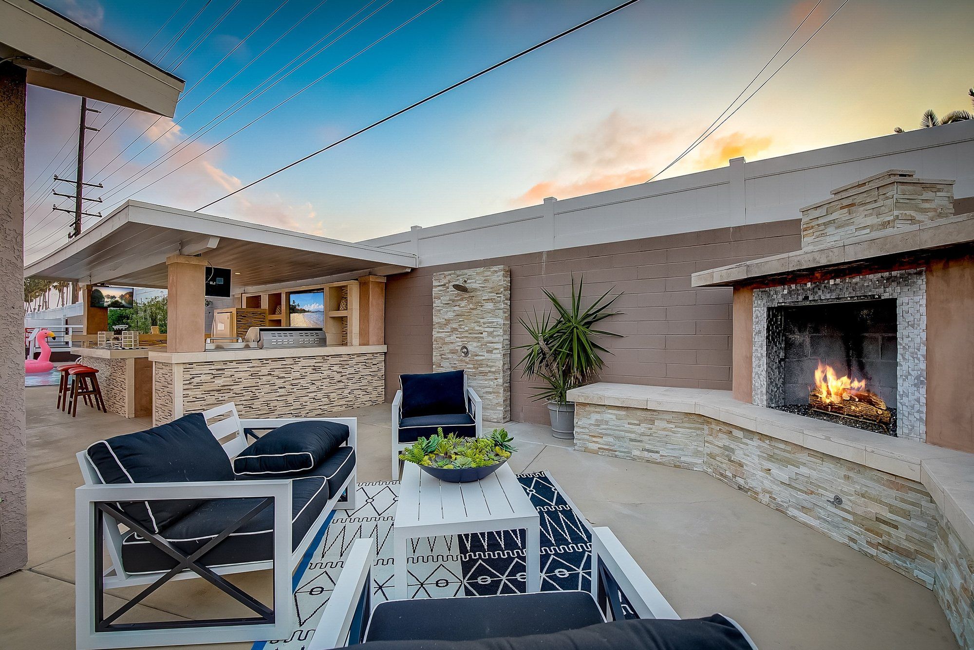Patio seating beside the outdoor fireplace, Huntington Beach