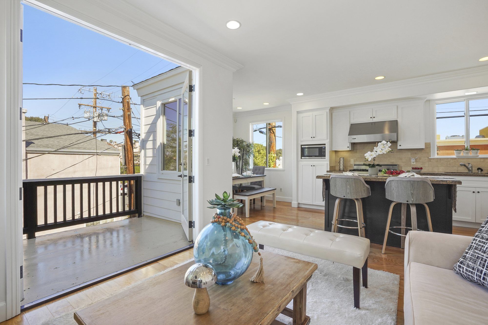 View from the living room through open doors to the balcony, Newport Beach