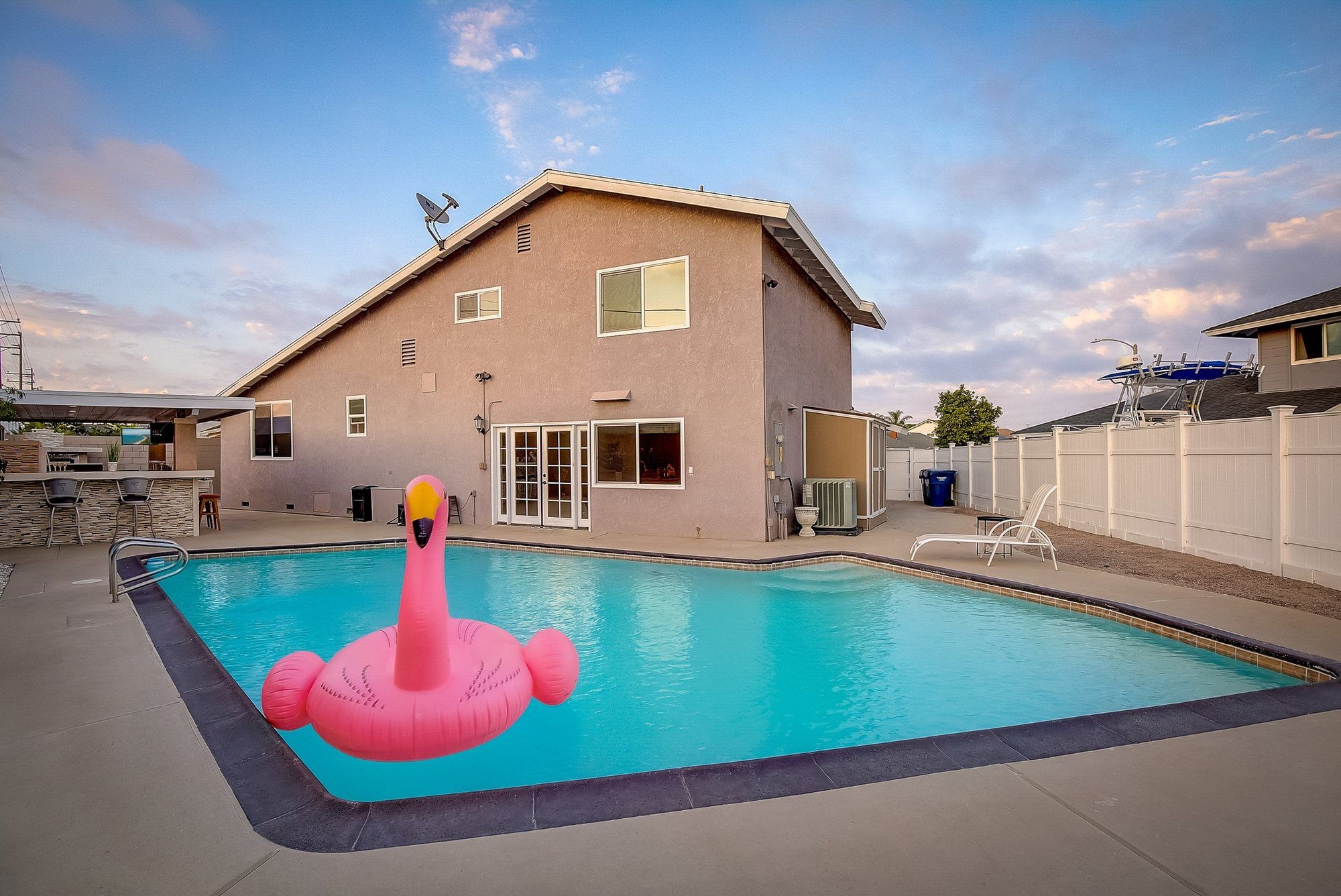 Backyard pool with an inflatable flamingo, Huntington Beach