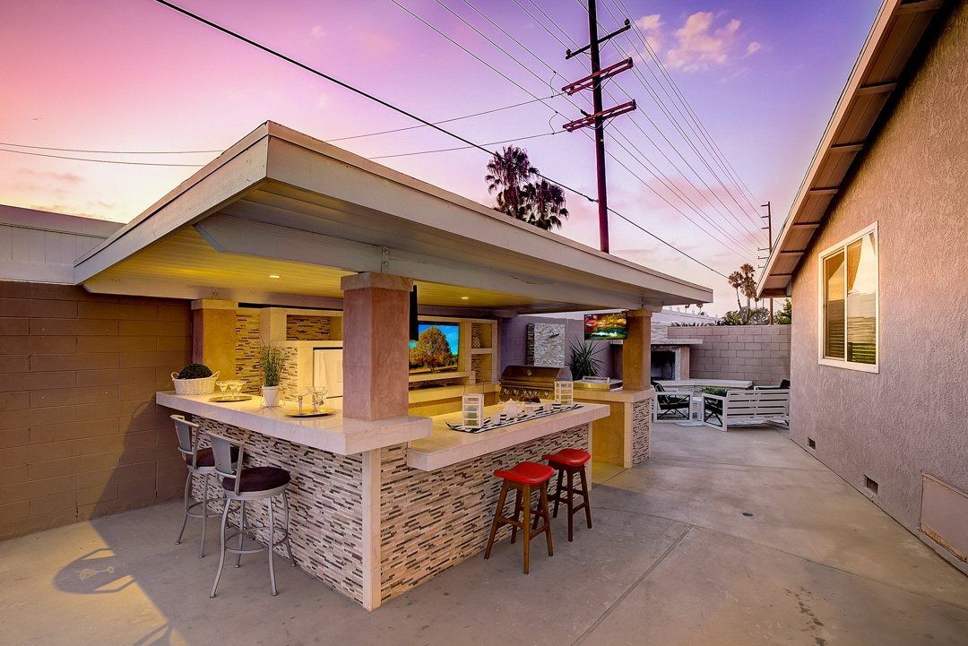 Covered outdoor kitchen at dusk, Huntington Beach