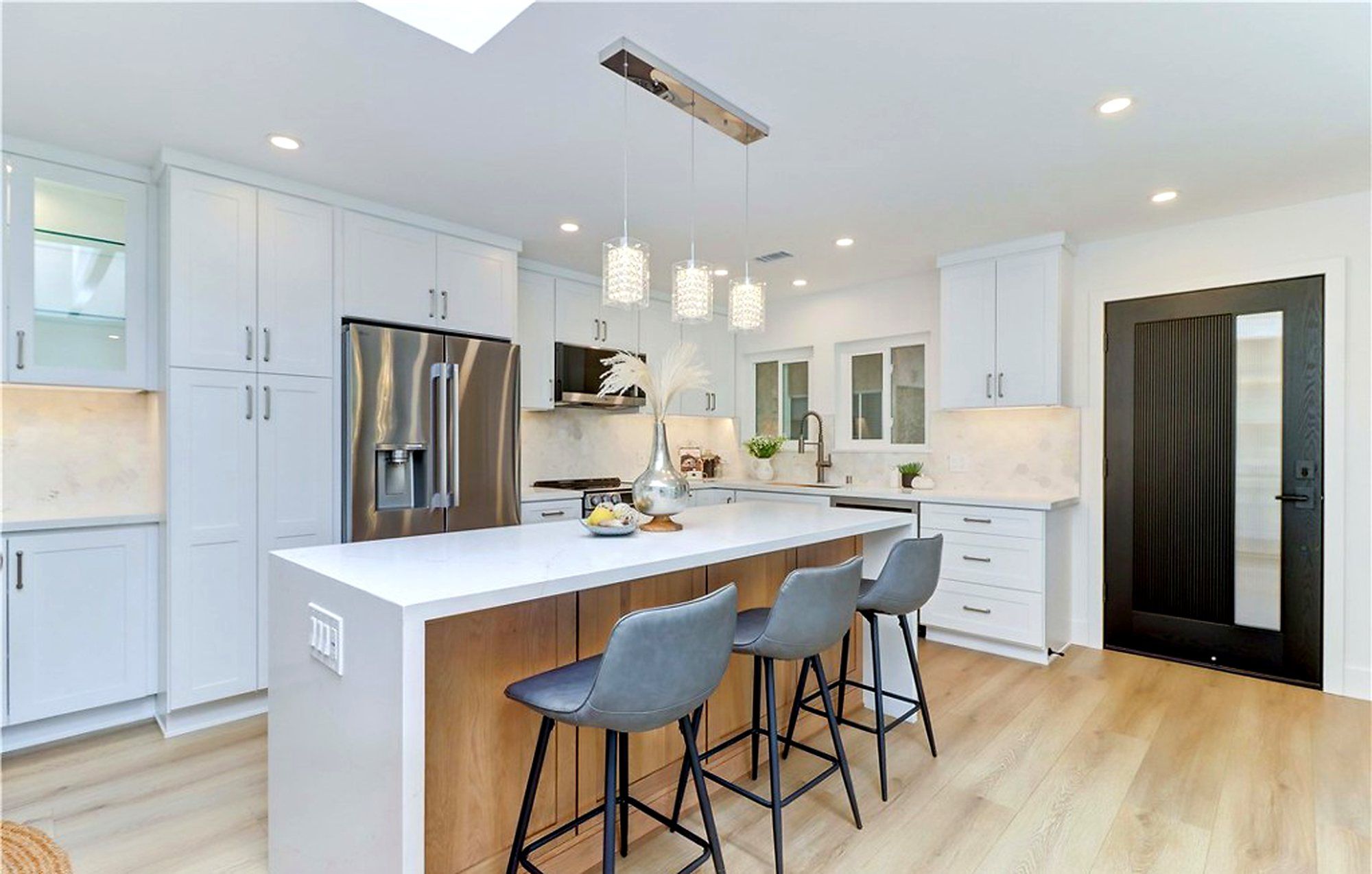 Kitchen island and tall white cabinets, Laguna Woods