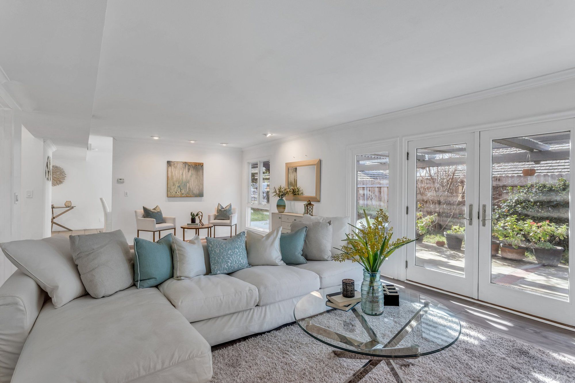 White sectional beside French doors to the patio, Tustin