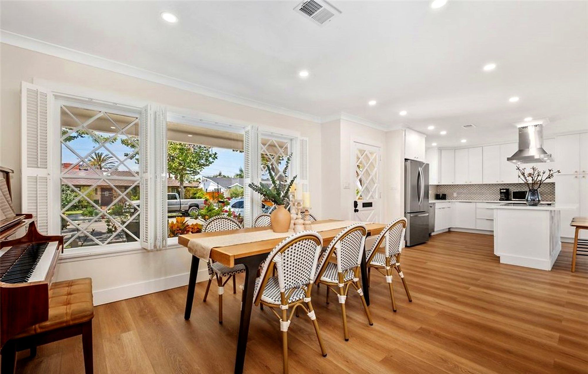 Dining table by the windows, with the kitchen beyond, Santa Ana