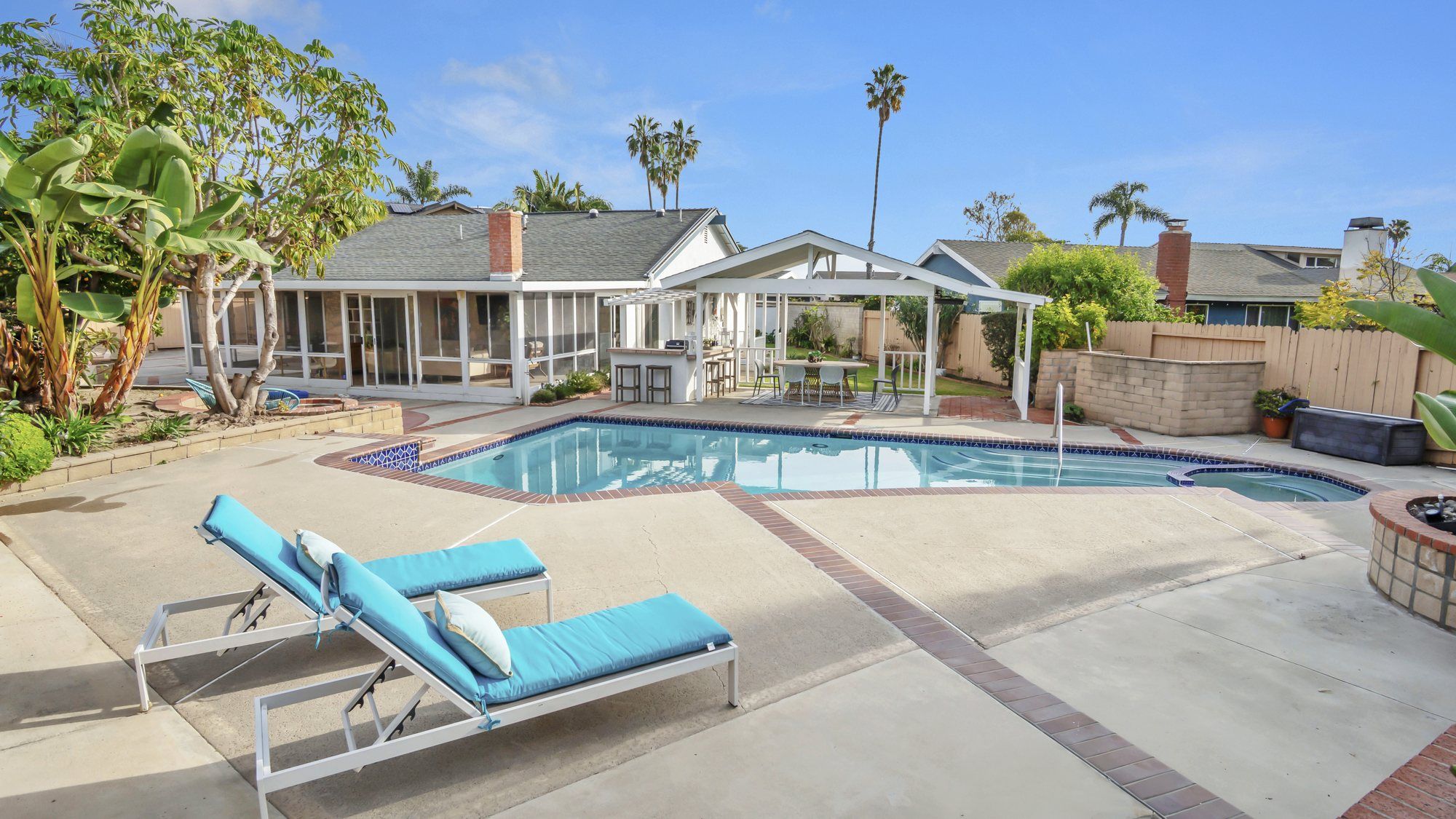 Two turquoise lounge chairs beside the pool, Dana Point