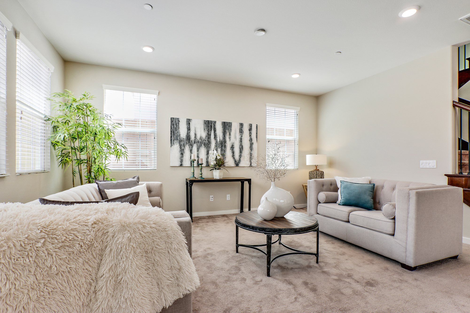 Family room with gray abstract art above a console, Irvine