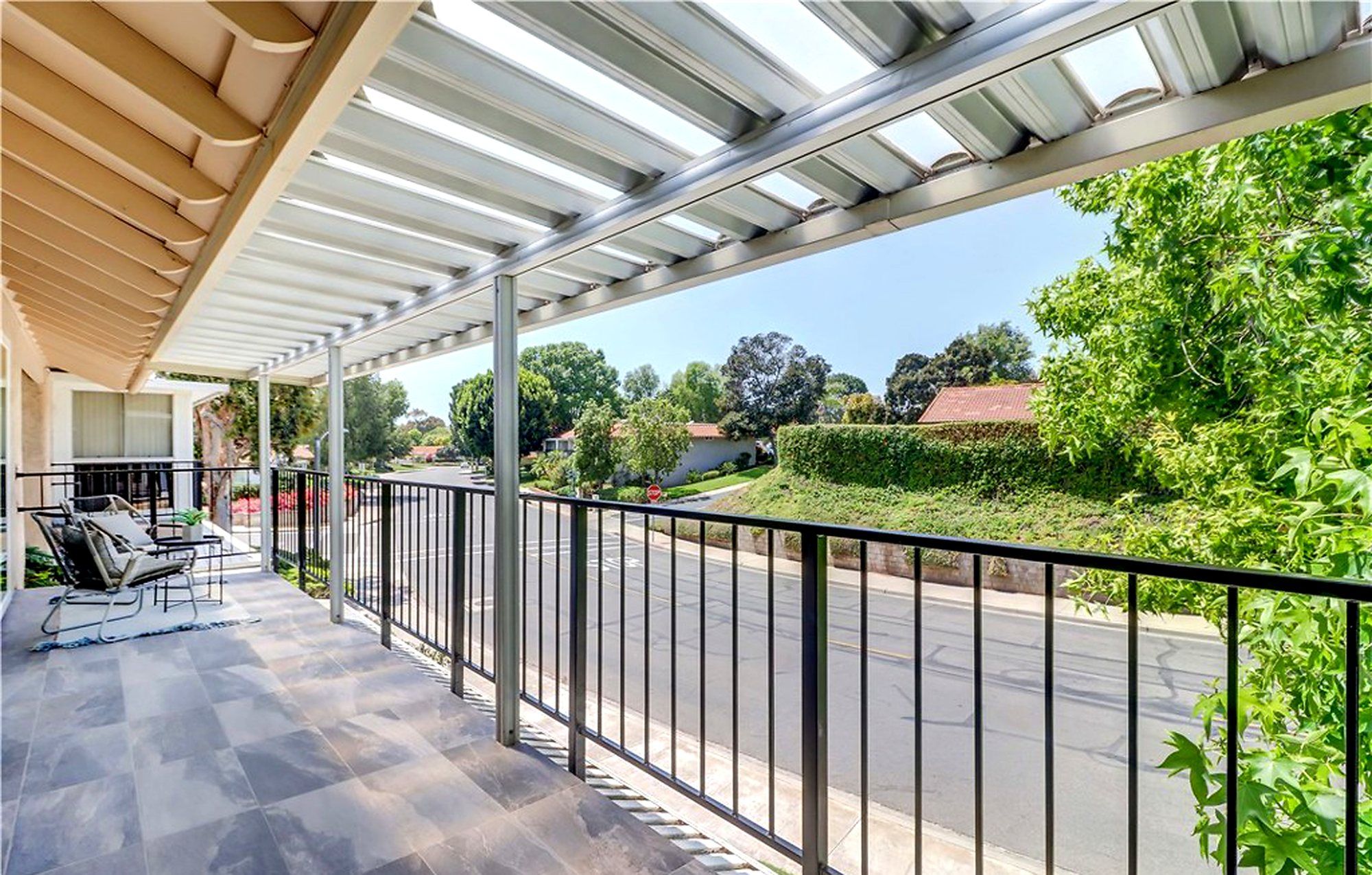 Covered balcony looking out to trees, Laguna Woods