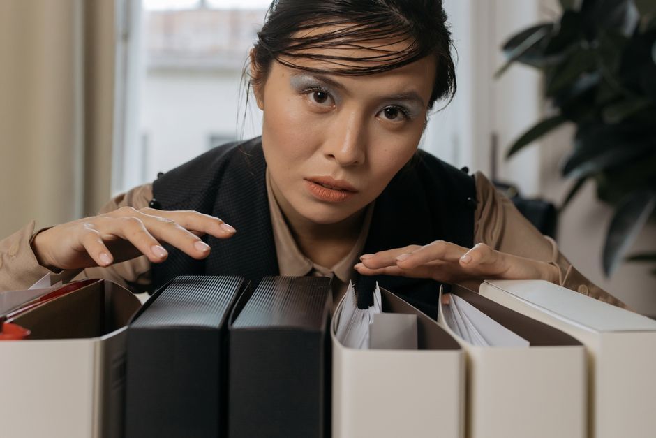 person organizing file folders
