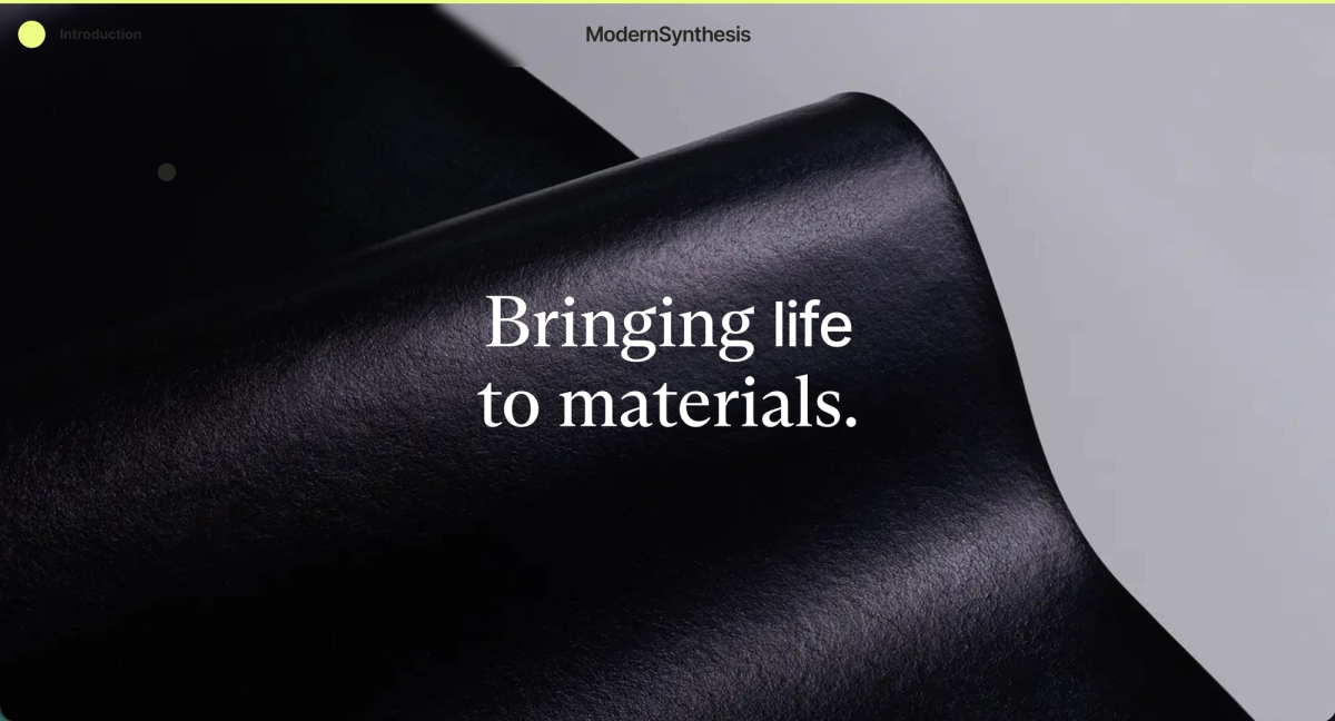 Modern Synthesis home page: a curl of black biomaterial with the words Bringing life to materials