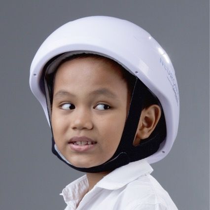 Young boy wearing a Neuronic helmet