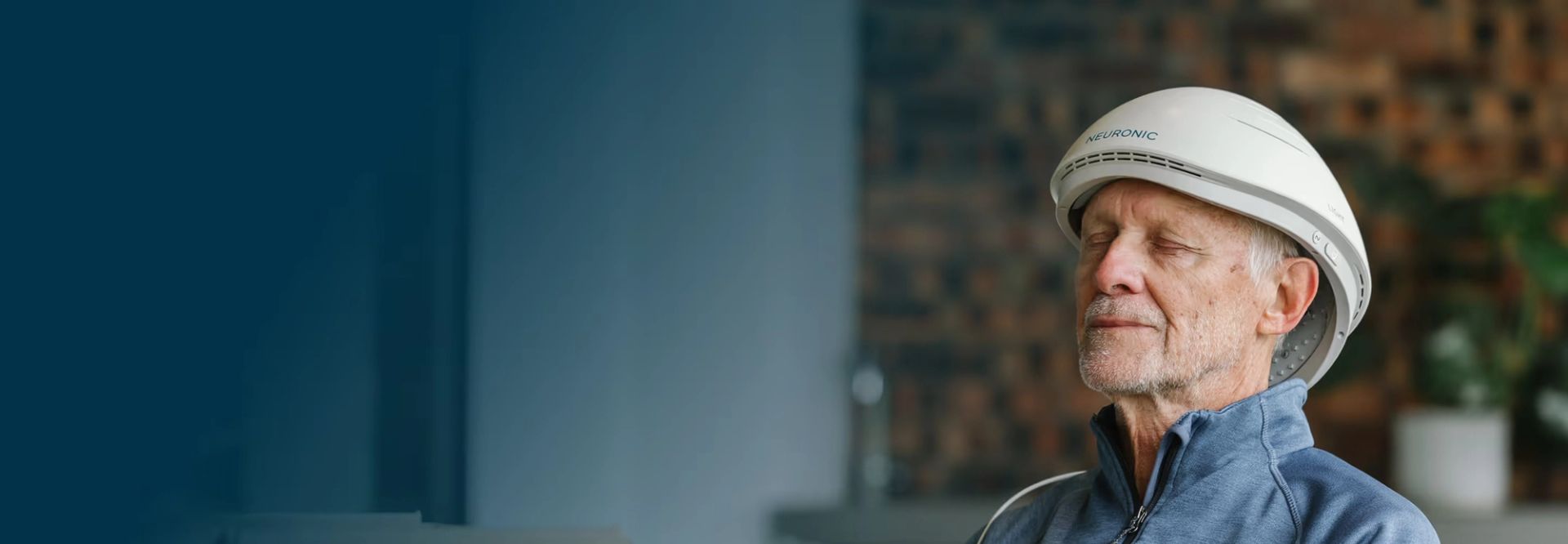 Man wearing Neuronic Helmet, eyes closed, facing right profile