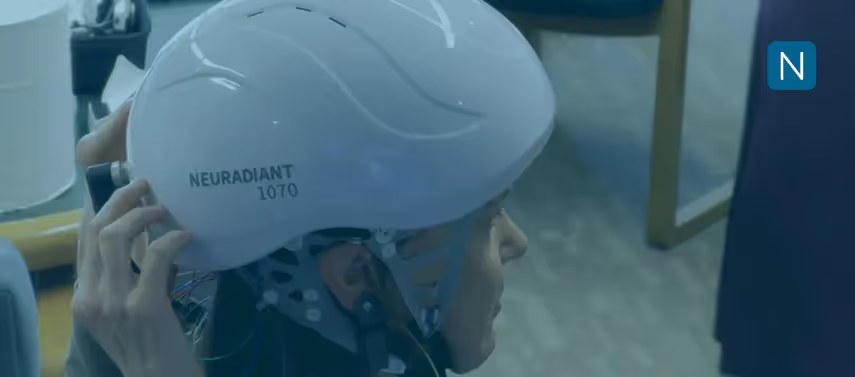 Person holding Neuronic Neuradiant 1070 helmet above their head