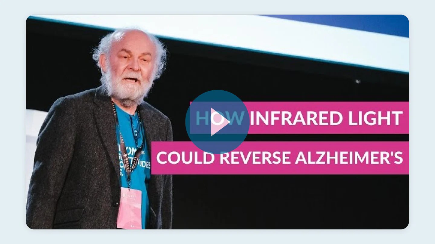 Older man speaking at presentation with text overlay reading "How Infrared Light Could Reverse Alzheimer's