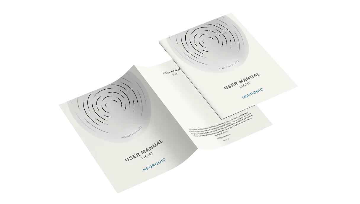 Two printed user manuals for Neuronic LIGHT displayed at angles, each showing a circular spiral pattern design on the cover