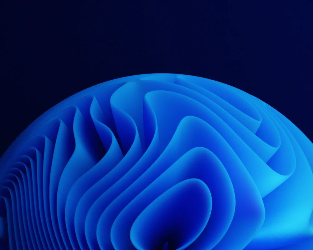 Abstract blue layered waves against dark background