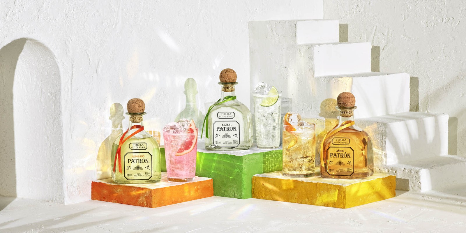 A trio Patron Bottles in a custom-built Mexican-inspired set photographed by Jason Bailey Studio