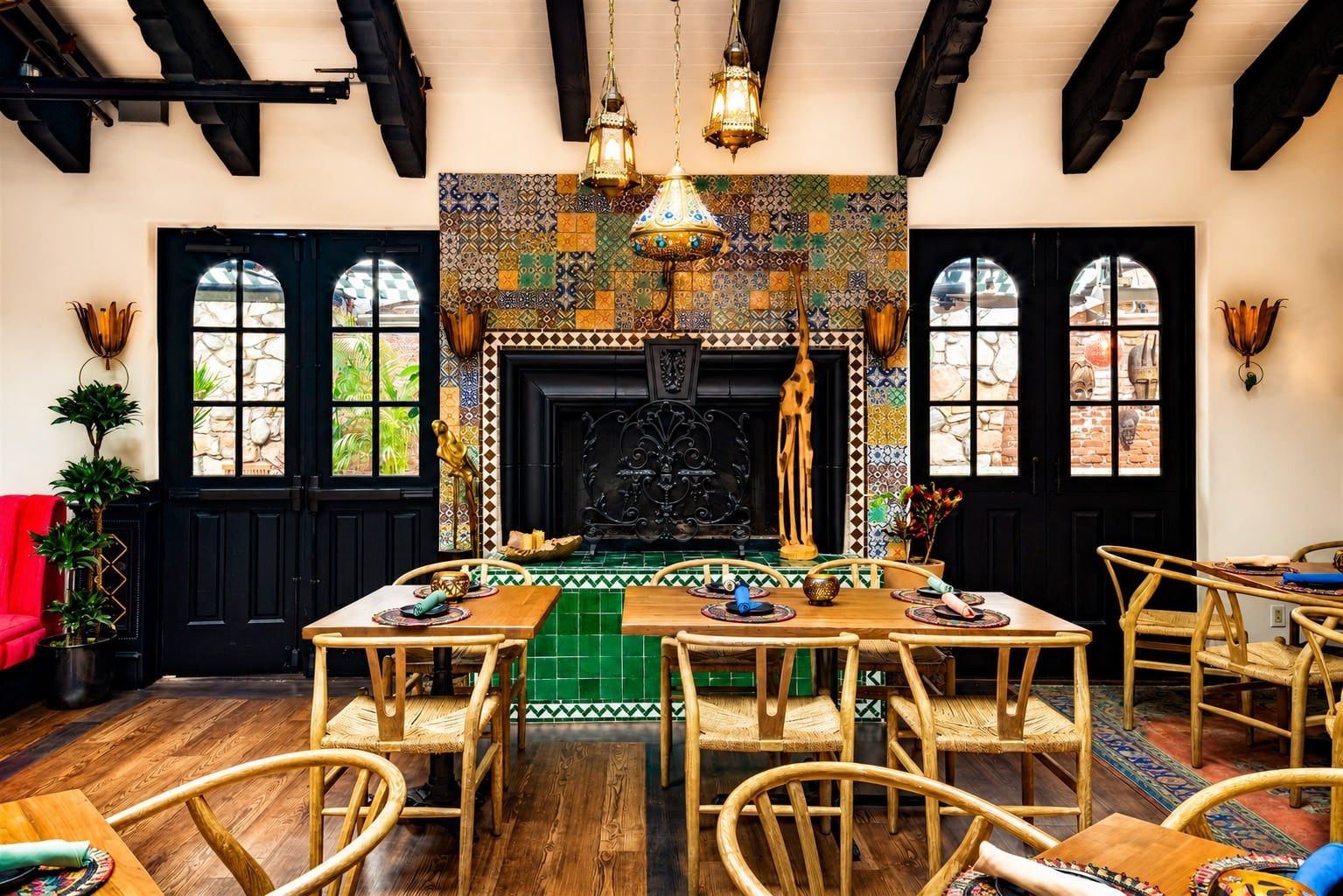 The Parrot Room fireplace and dining tables