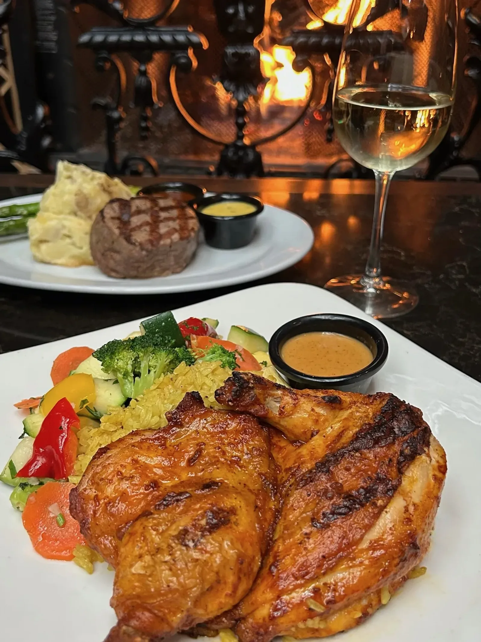Flame-roasted peri-peri chicken over yellow rice with an ocean view at Mozambique