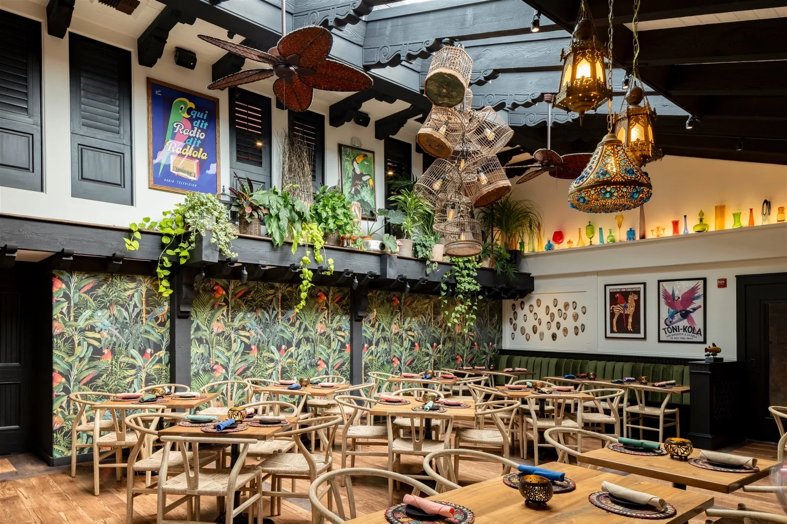 Parrot Room dining room with tropical wallpaper and set tables