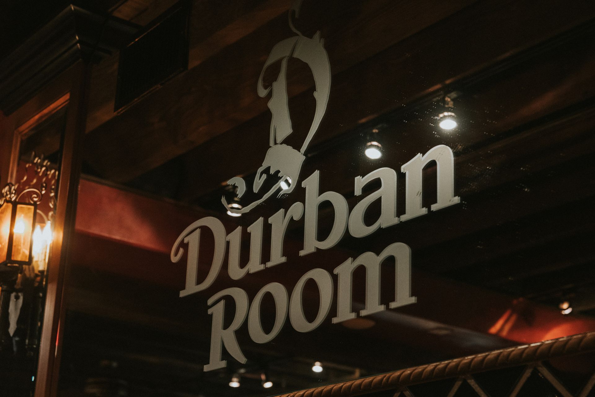 Durban Room sign on the wall above the bar