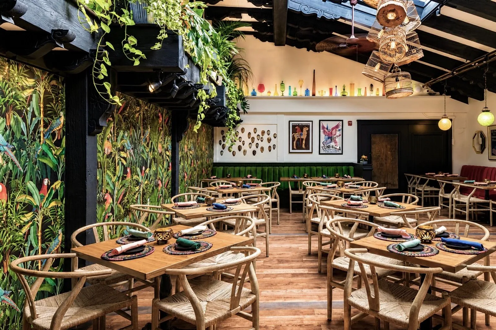 Parrot Room tables along a tropical-print wall under a skylight