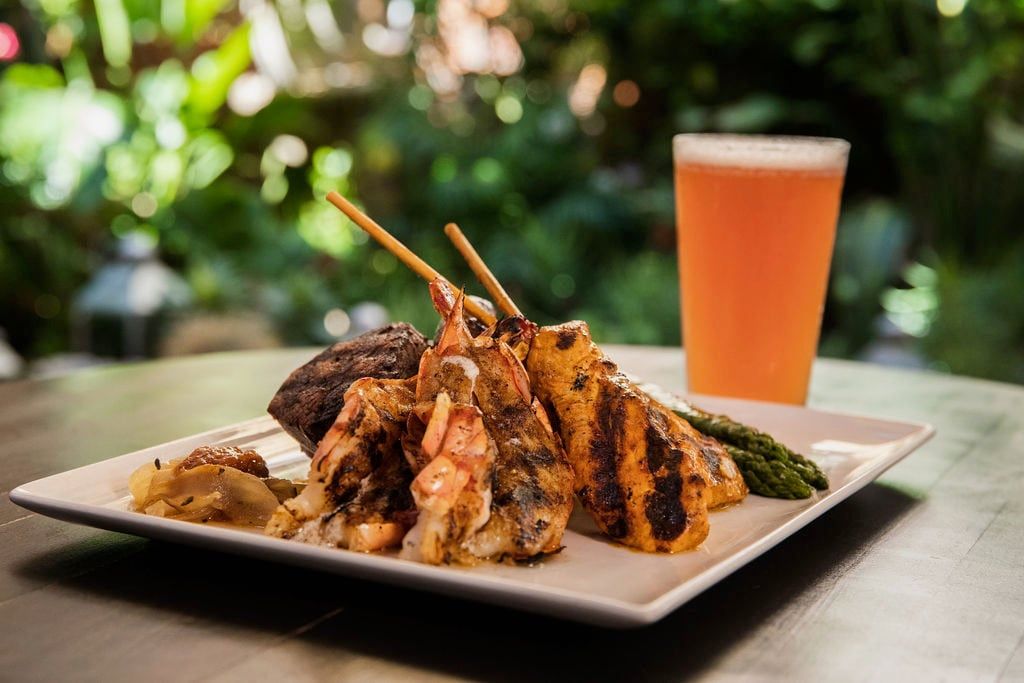 Mixed grill skewers with a glass of beer on the Garden Patio