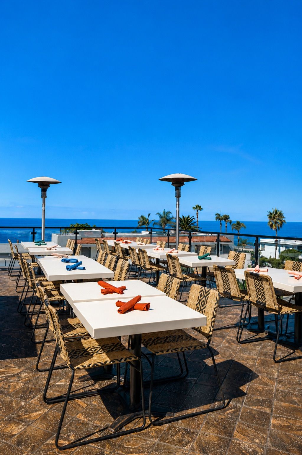 Veranda Rooftop tables in the sun with an ocean view