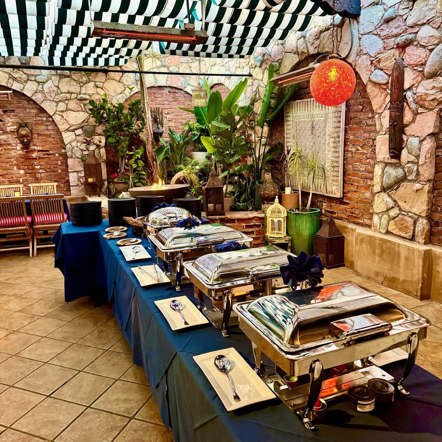 Buffet with chafing dishes set up on the Garden Patio for an event
