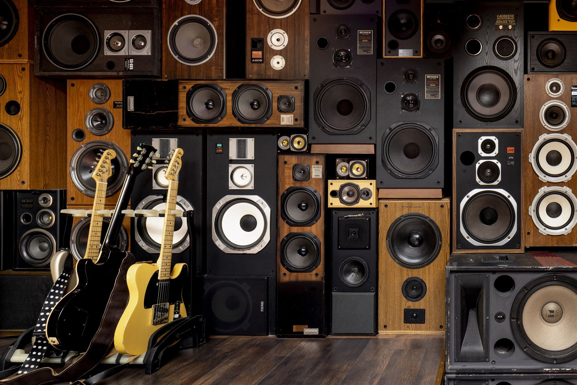 Wall of vintage speakers and guitars at Ivan'z House