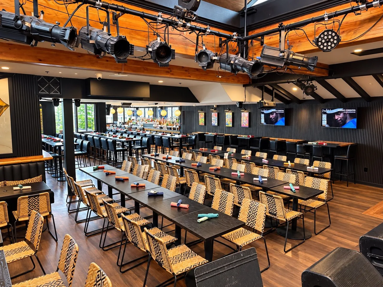 Ivan'z House set with long rows of tables facing the stage under stage lights