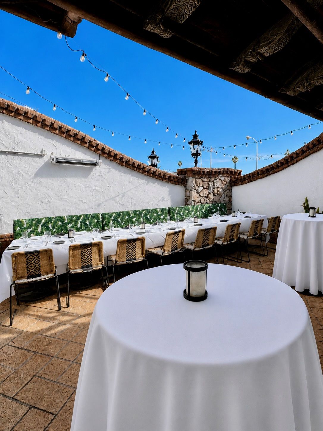 Palm Patio set with white-linen tables for an event