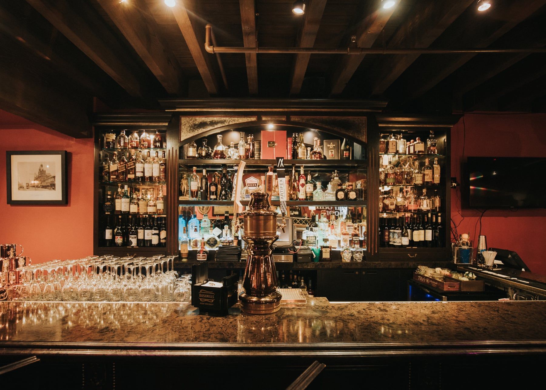 The Durban Room bar with backlit bottle shelves and a polished wood counter