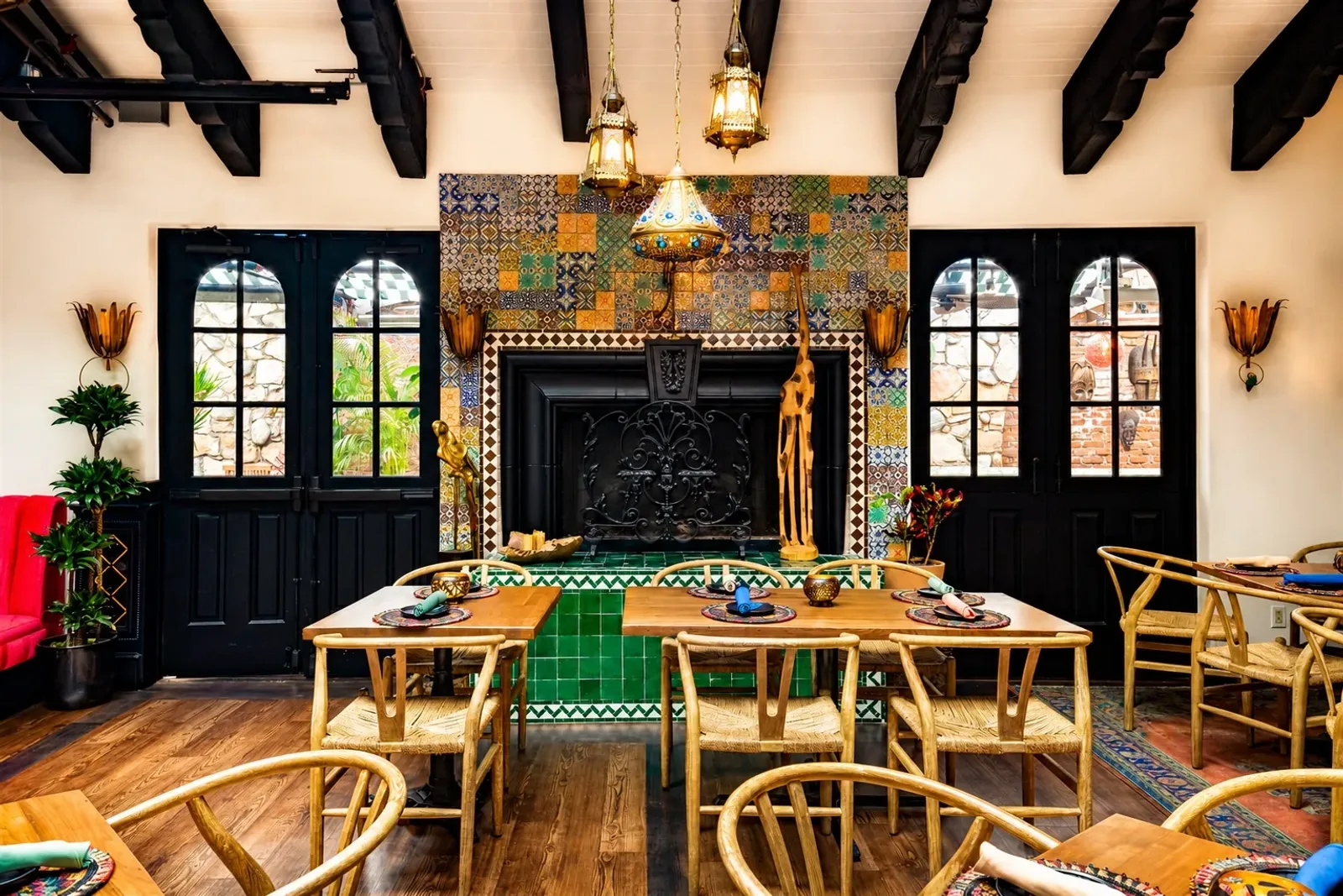 The Parrot Room at Mozambique with fireplace and dining tables