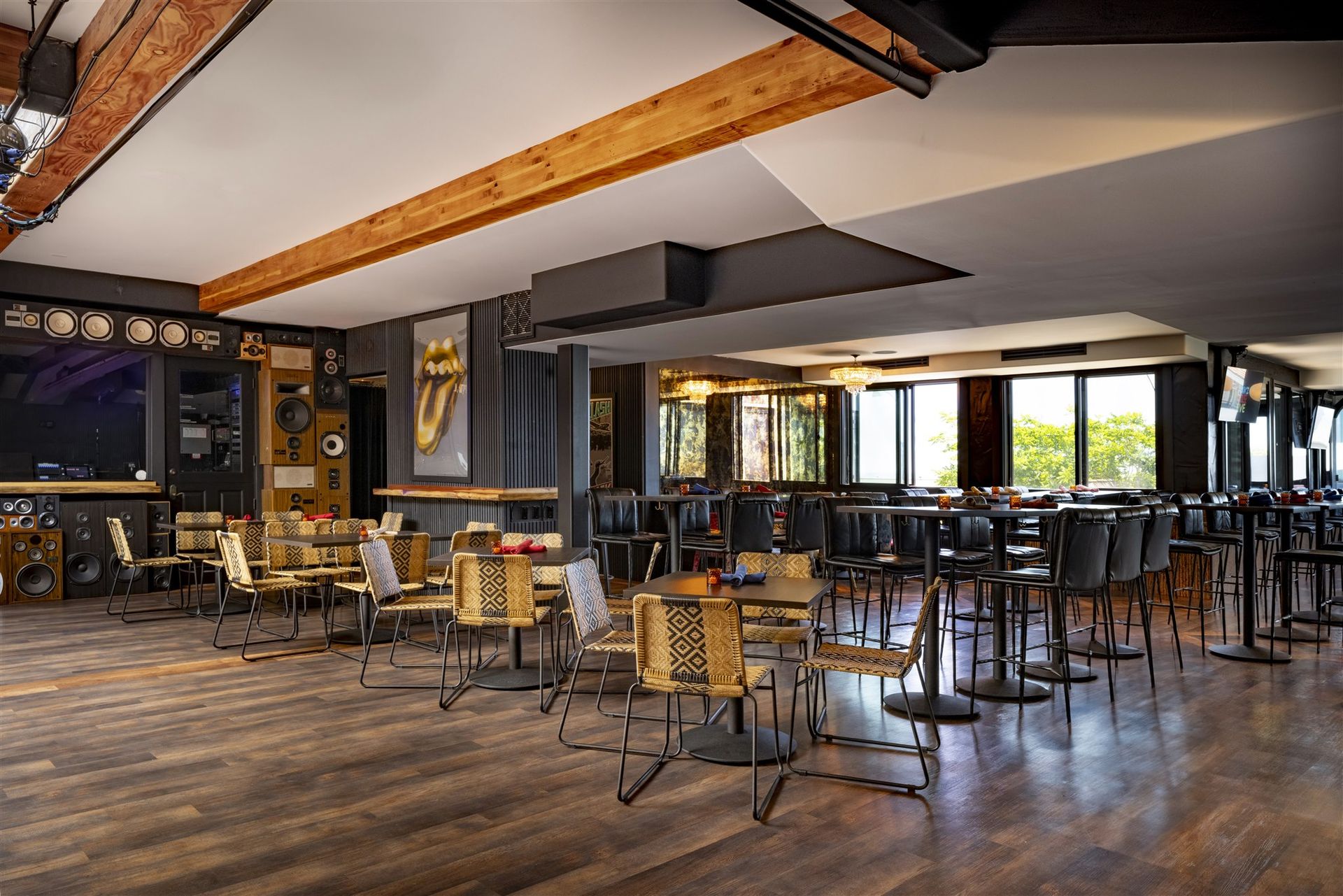 Ivan'z House dining room with wood beams, tables and windows