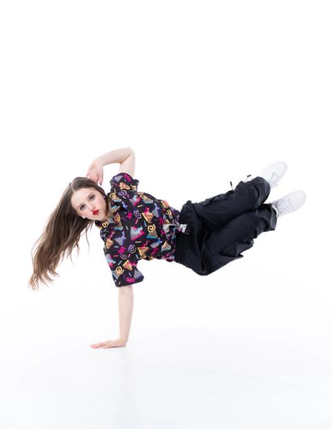 A dancer leaps through the air