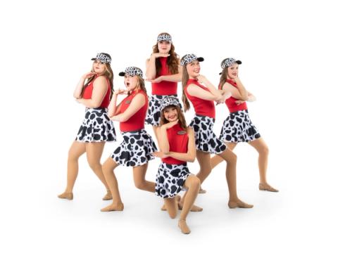 A group of dancers pose in red and black costumes