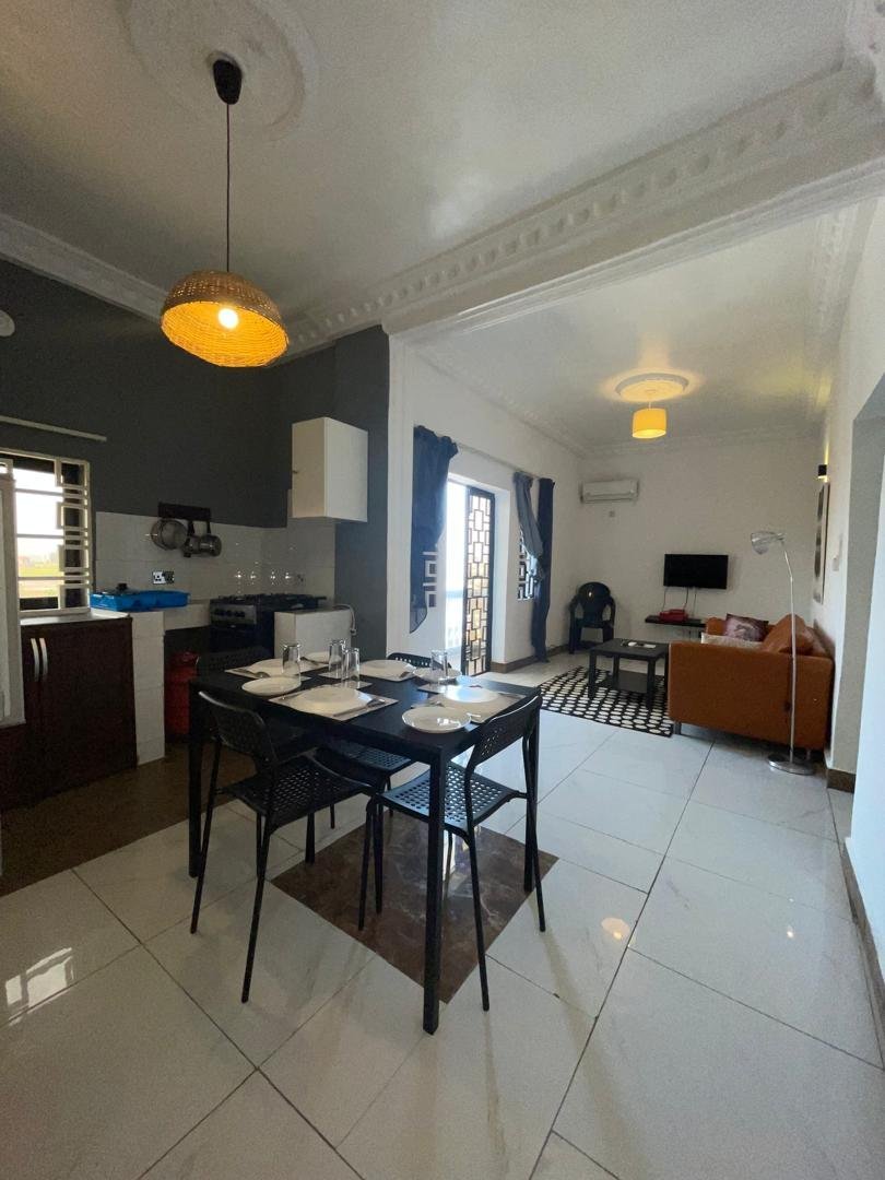 Apartment kitchen and dining area with pendant lighting