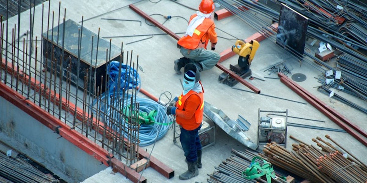 Construction site with workers coordinating
