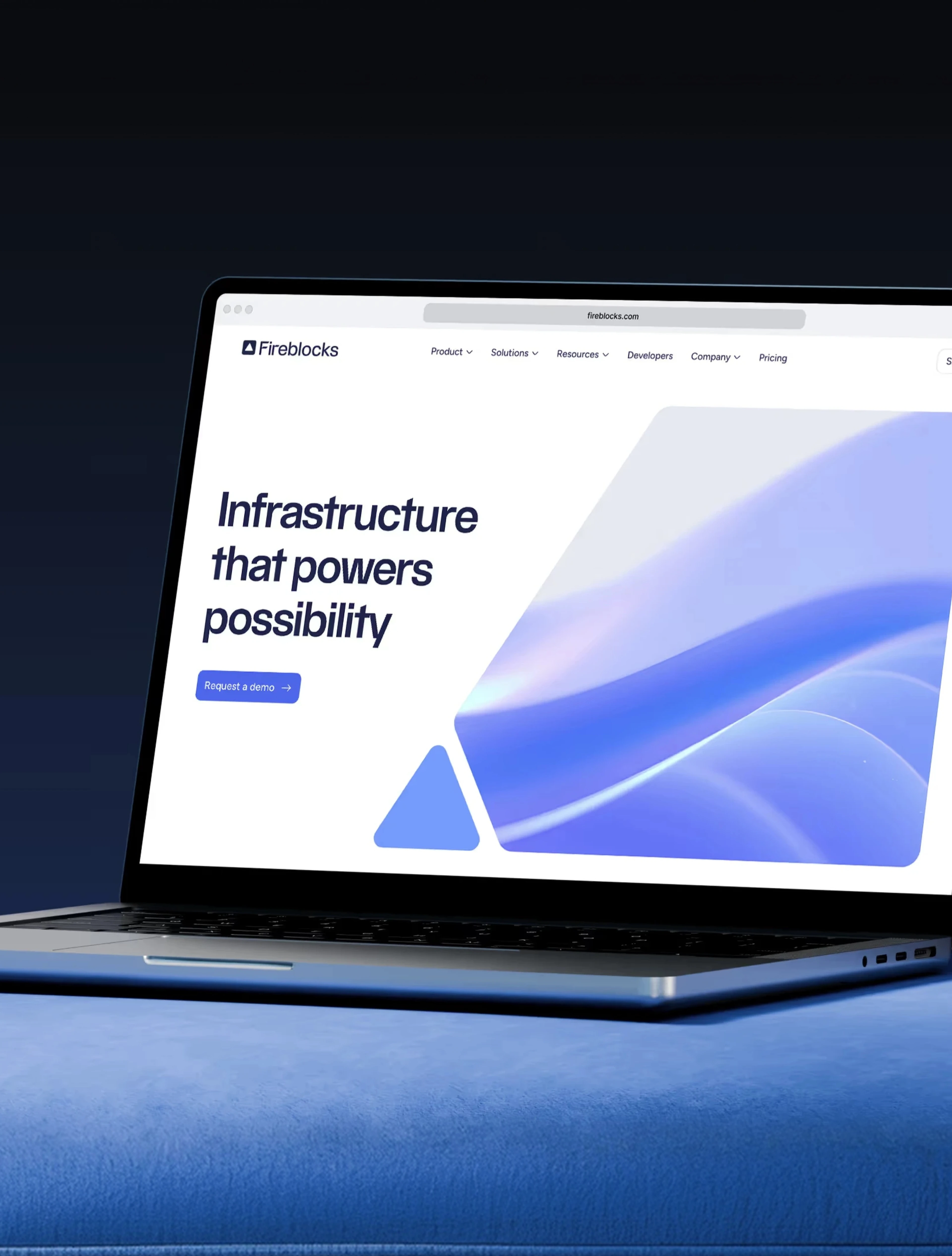 The Fireblocks site on a laptop, 'Infrastructure that powers possibility'