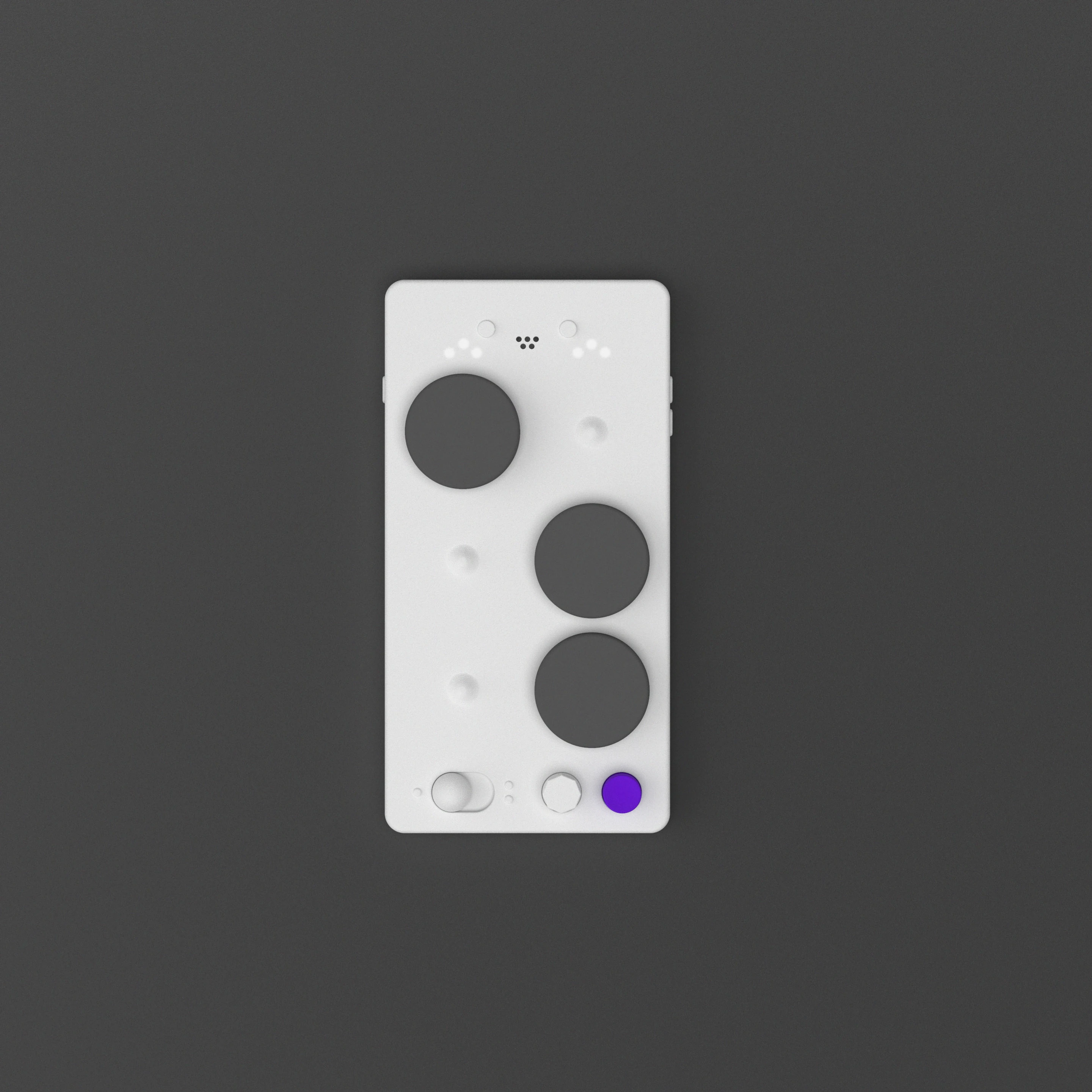 Top view of the LUII Braille board, its magnetic dots, dial and read button