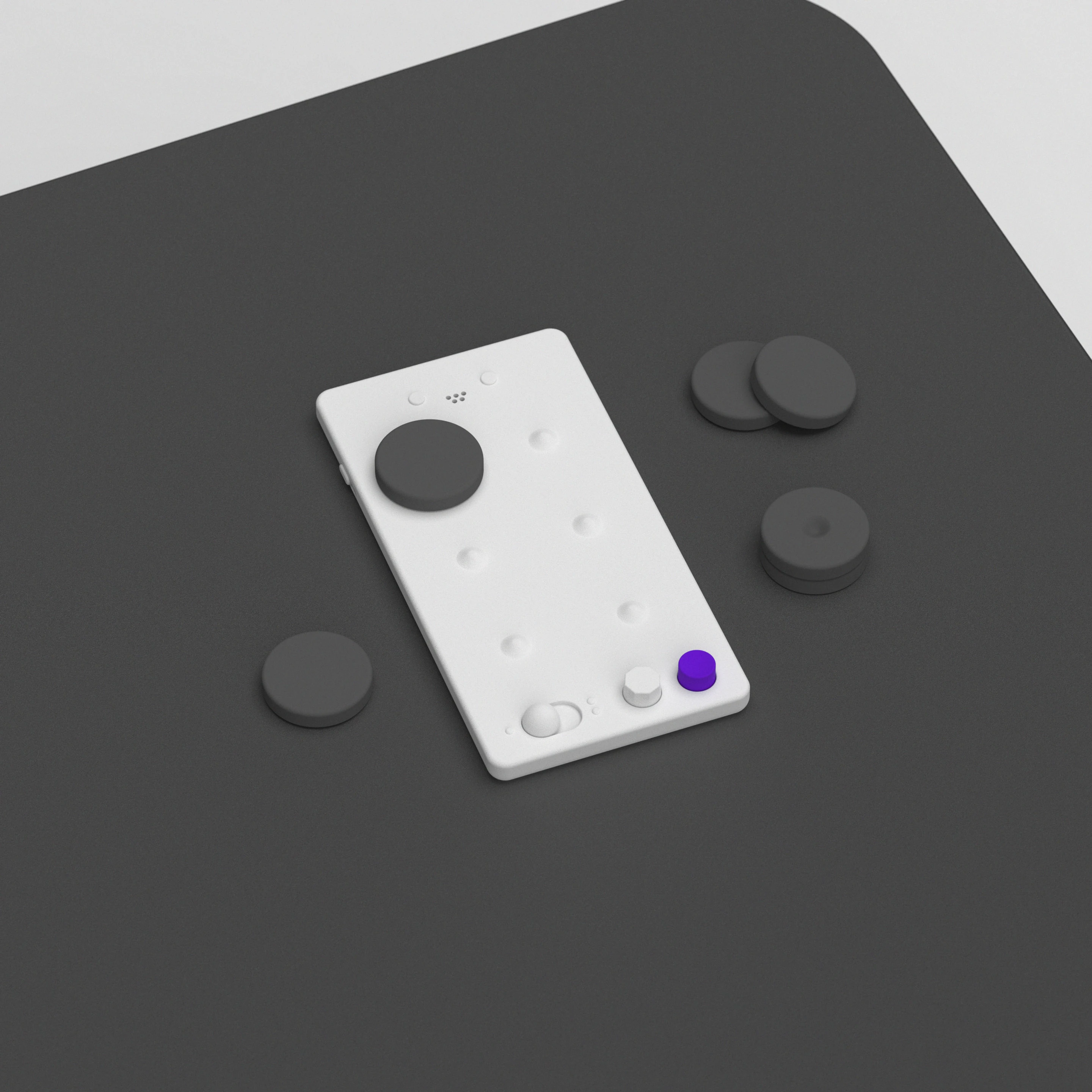 LUII Braille board with its magnetic dots laid out beside it