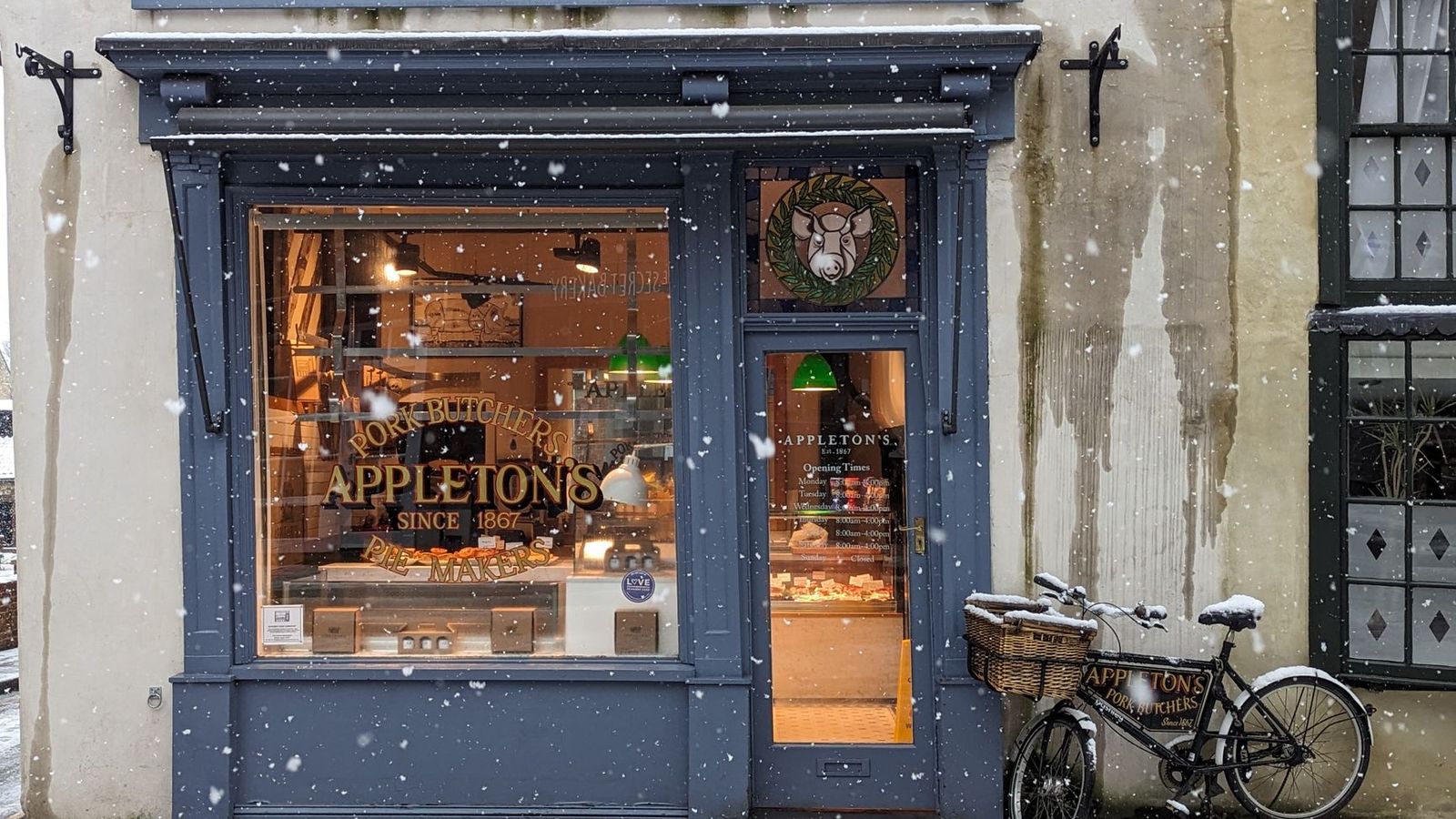 A local butcher shop on a snowy winter day.