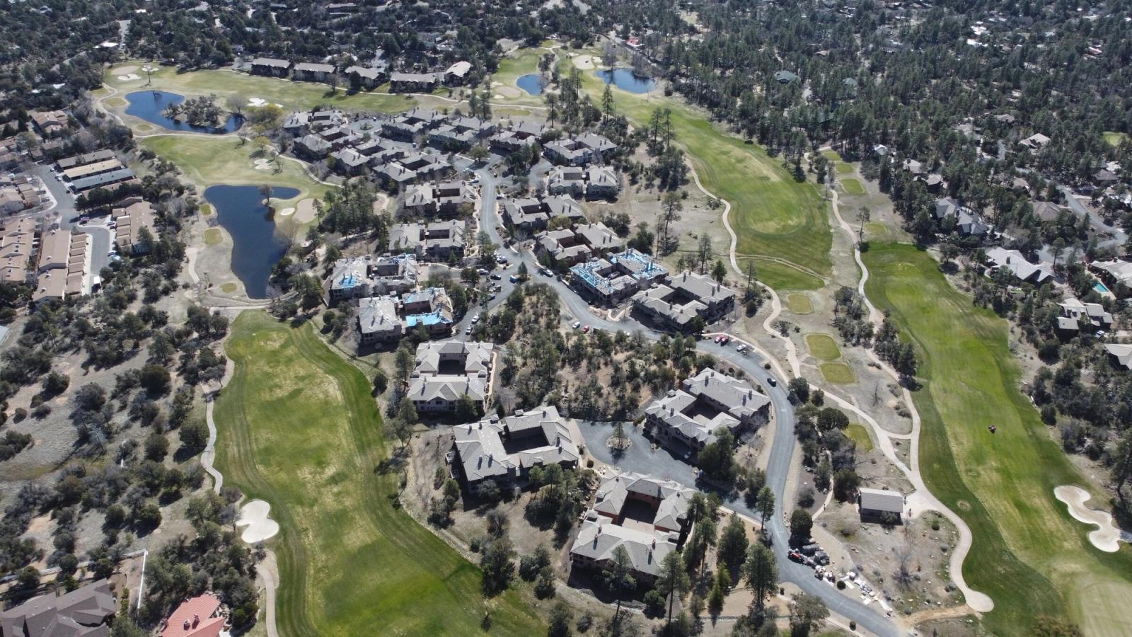 A Prescott neighborhood from the air after a full re-roof, with the golf course and pond beyond it, April 2023.