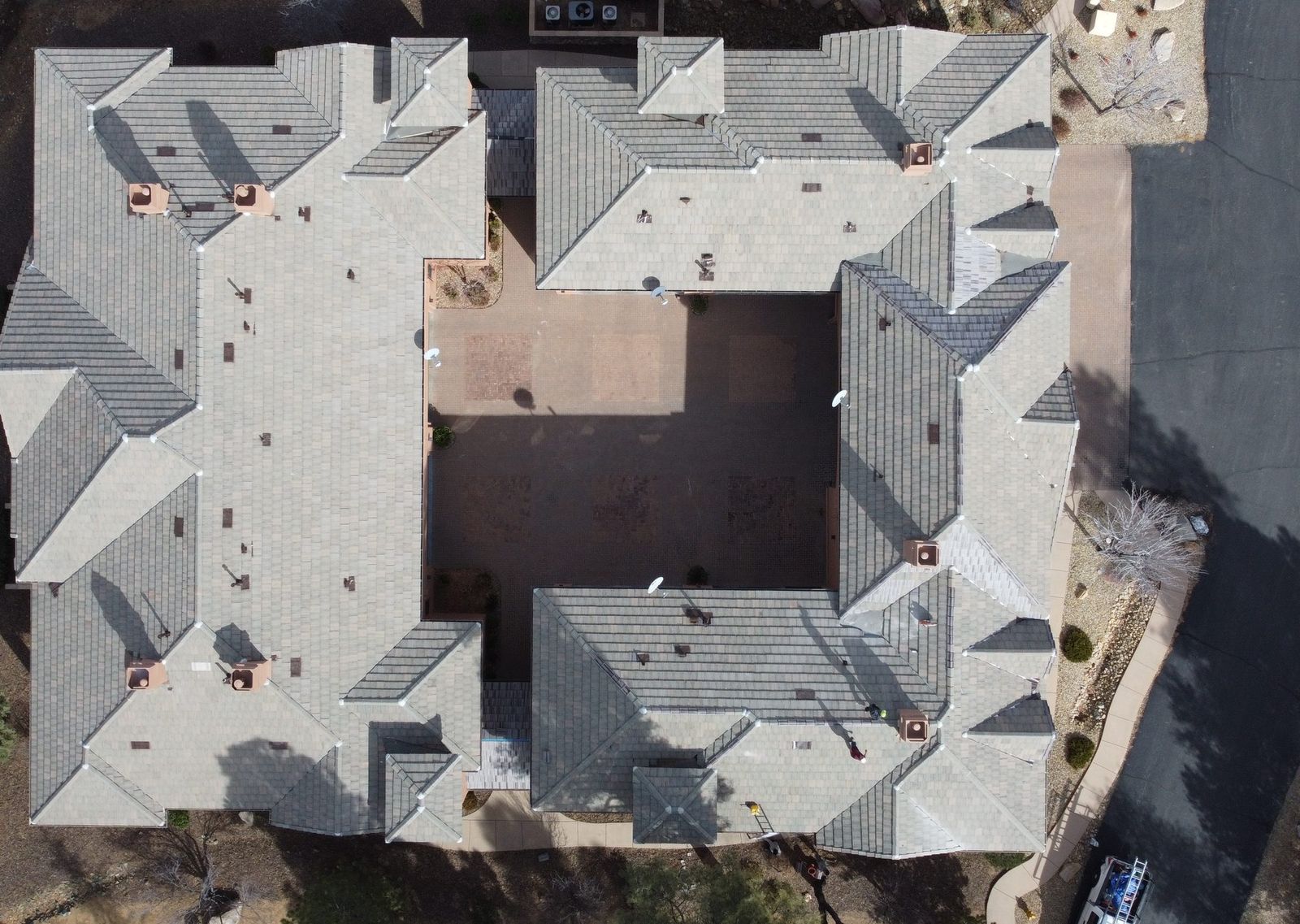 A completed shingle roof seen from above, Prescott, January 2023.
