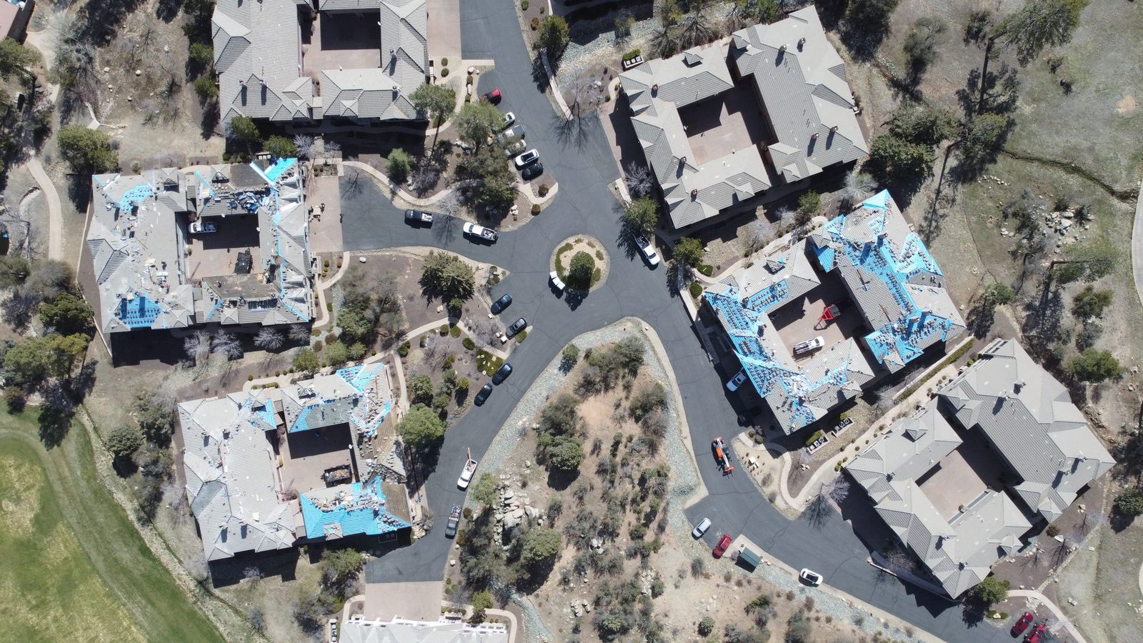 A multi-building re-roof in progress with underlayment down, Prescott, April 2023.