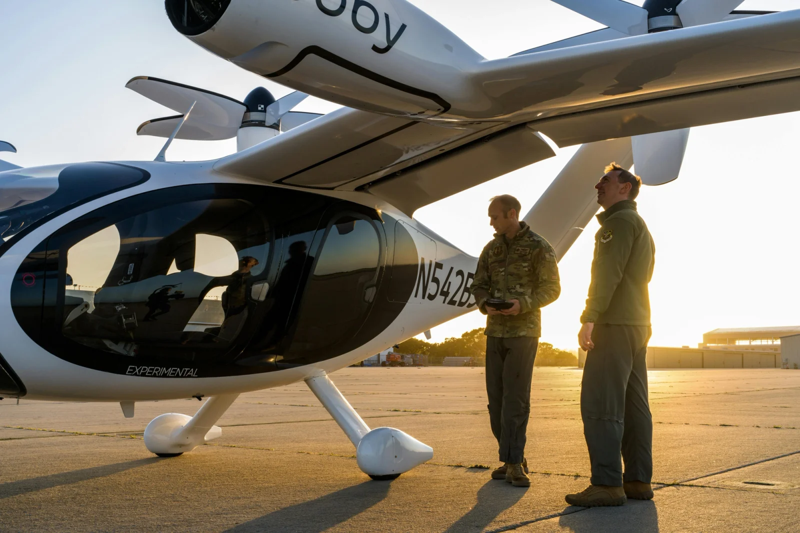 Two U.S. Air Force pilots inspect Joby’s eVTOL aircraft in advance of remotely piloted flights. Photo: Joby Aviation