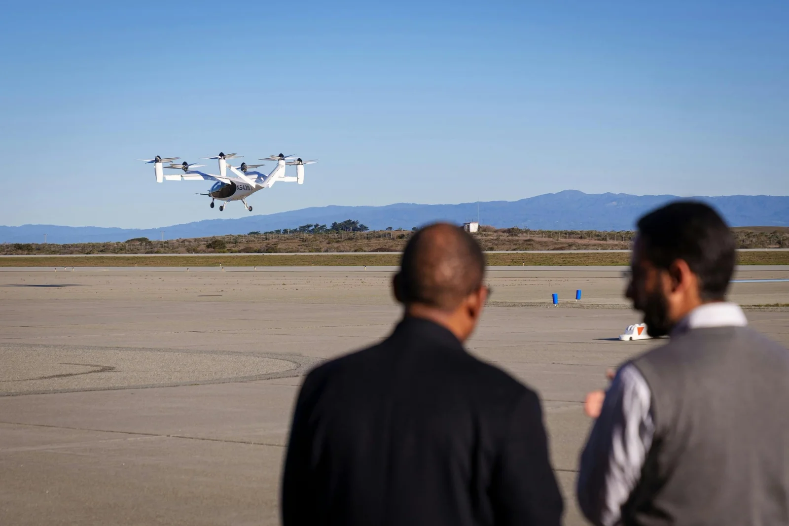 FAA Acting Administrator Billy Nolen and Joby Head of Aircraft OEM Didier Papadopoulos watch Joby's all-electric aircraft take off at Marina Airport, CA.